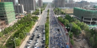 5月14日，参加京津冀(文安)企业家马拉松的选手正在比赛。　陈有柱 　摄 - 中国新闻社河北分社
